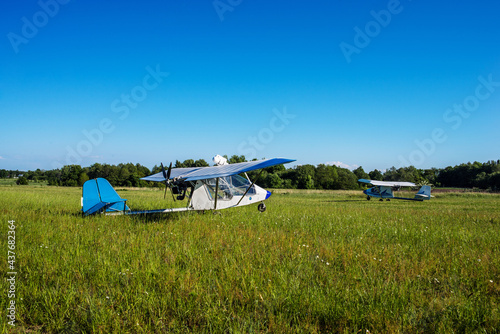 two white light civil aviation aircraft on a moen greenfield photo
