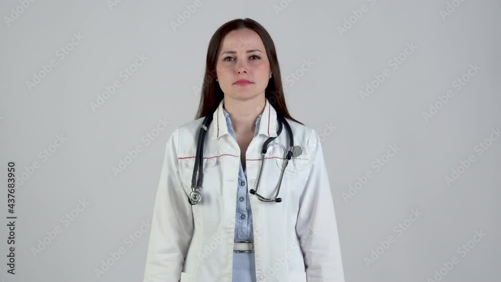 Portrait of smiling female doctor in medical Uniform looking at camera with stethoscope isolated on white background. Health care and medical concept. Medical workers. Portrait of smiling female doctor in medical Uniform looking at camera with stethoscope isolated on white background. Health care and medical concept. Medical workers.