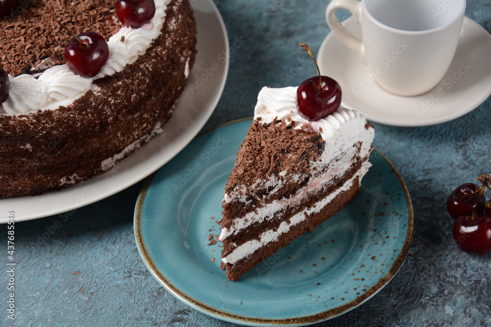 Black forest cake, Schwarzwald pie, dark chocolate and cherry dessert . Black forest cake decorated with whipped cream and cherries.