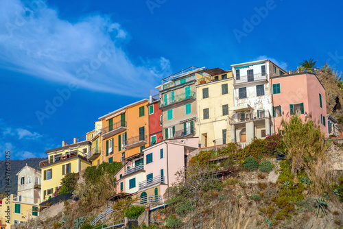 Corniglia, Colorful cityscape on the mountains over Mediterranean sea in Cinque Terre Italy © f11photo