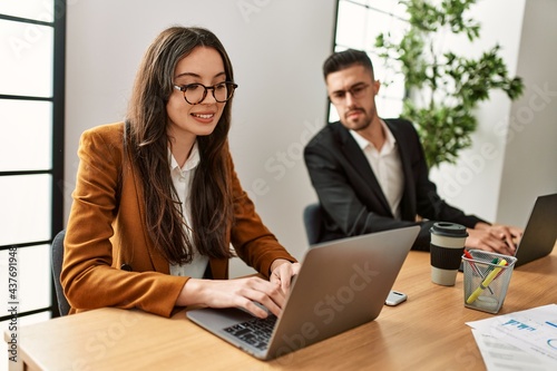 Quadro em tela Hispanic business worker working and spying partner at the office