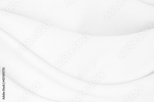 Beautiful white fabric waves, soft focus, used for backgrounds. White cloth background