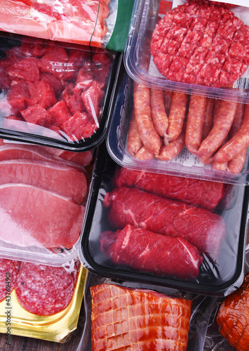 Composition with packages of assorted meat products