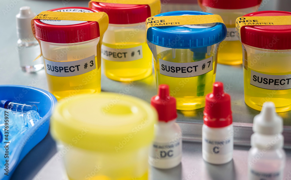 Various containers with human urine, crime lab, murder suspects labelled on each, conceptual image Various containers with human urine, crime lab, murder suspects labelled on each, conceptual image