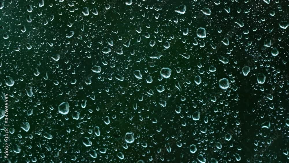 heavy rain falling on the window surface 