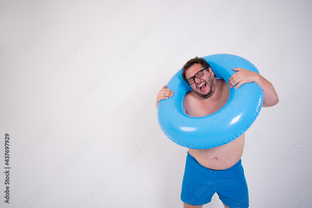 Vacation and Holidays. Funny fat man with a rubber ring. Vacation and Holidays. Funny fat man with a rubber ring.