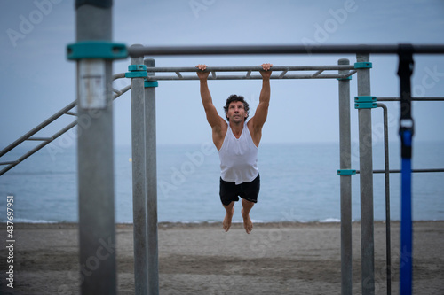 Male athlete exercising at the beach