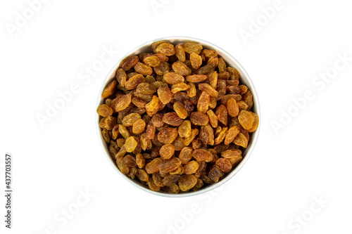 dried raisins in a bowl on a white background