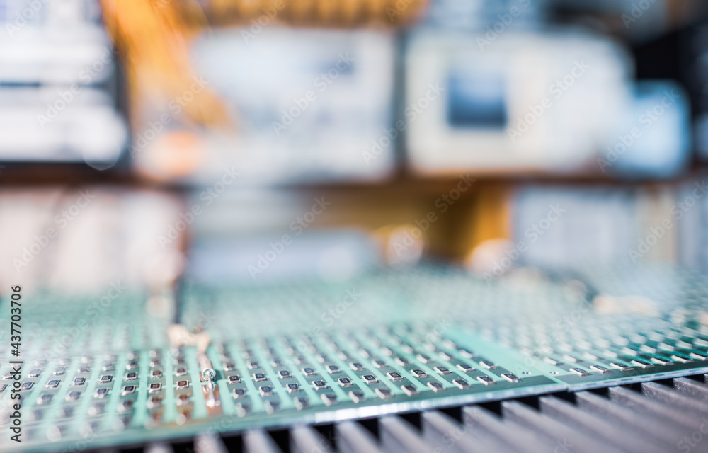 Microcircuits and components lie on metal plates Microcircuits and components lie on metal plates
