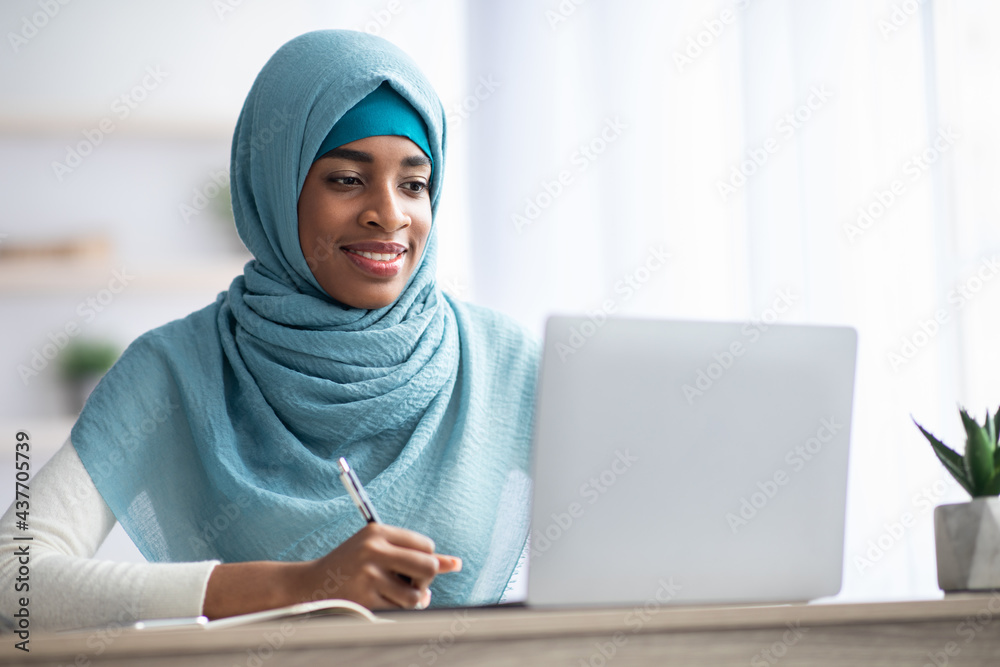 Online Education. Black Muslim Lady In Hijab Studying With Laptop At Home Online Education. Black Muslim Lady In Hijab Studying With Laptop At Home