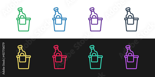 Set line Bottle of champagne in an ice bucket icon isolated on black and white background. Vector