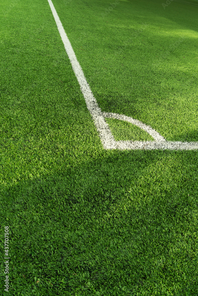 green artificial grass football or soccer field with white line background