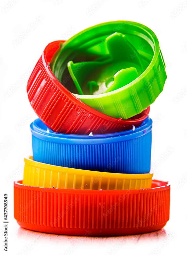 Colorful plastic bottle caps isolated on white. Recycling Colorful plastic bottle caps isolated on white. Recycling