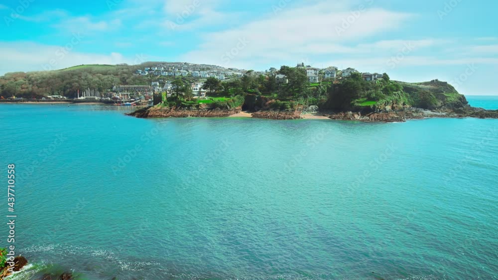 A view to and from Readymoney Cove, Fowey, Cornwall, the United Kingdom in 4K. A beautiful landscape scenery with ocean and rocky seashores. A view to and from Readymoney Cove, Fowey, Cornwall, the United Kingdom in 4K. A beautiful landscape scenery with ocean and rocky seashores.