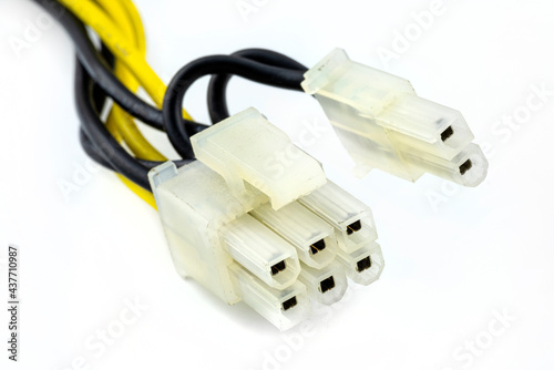 A 6+2 pin female plug for powering a graphic cards coming from a computer power supply, isolated on a white background. photo