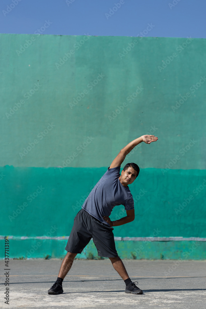 Mexican young man exercising outdoors urban exercise