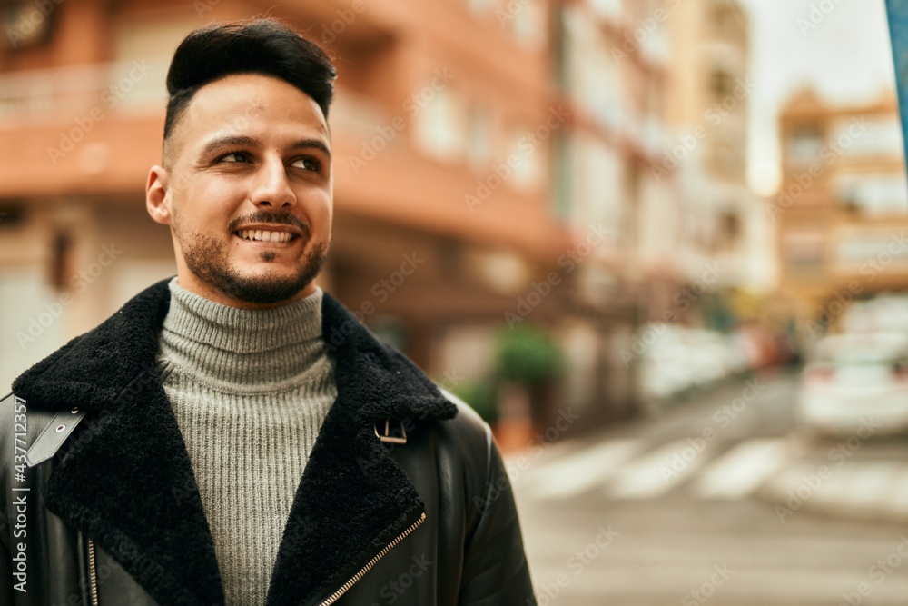 Young arab man smiling happy standing at the city. Young arab man smiling happy standing at the city.