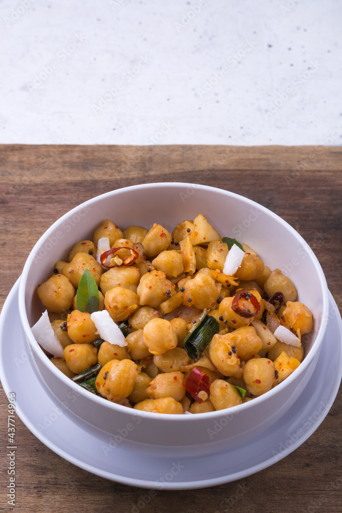 cooked chickpeas or grams dish, also known as garbanzo beans or egyptian peas boiled and tempered with oil and coconut, healthy vegetarian dish cooked chickpeas or grams dish, also known as garbanzo beans or egyptian peas boiled and tempered with oil and coconut, healthy vegetarian dish