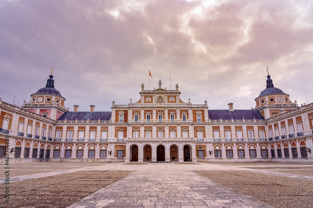 Main facade of the royal palace of Aranjuez with its rows of windows and two domes. Madrid.