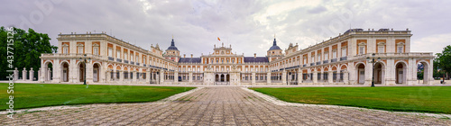 Great panoramic view of the main fa  ade of the Aranjuez palace on a cloudy day at dawn. Madrid.