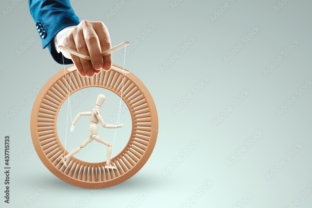 Male hand, puppeteer controls the puppet puppet with strings. The