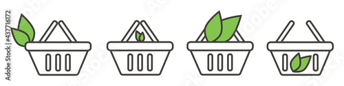 Shopping basket icons with a green leaf on white isolated background. Healthy food concept.