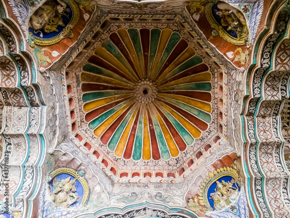 The ornate, colorfully painted ceiling of the ancient 17th century Maratha Palace in the town of Thanjavur.