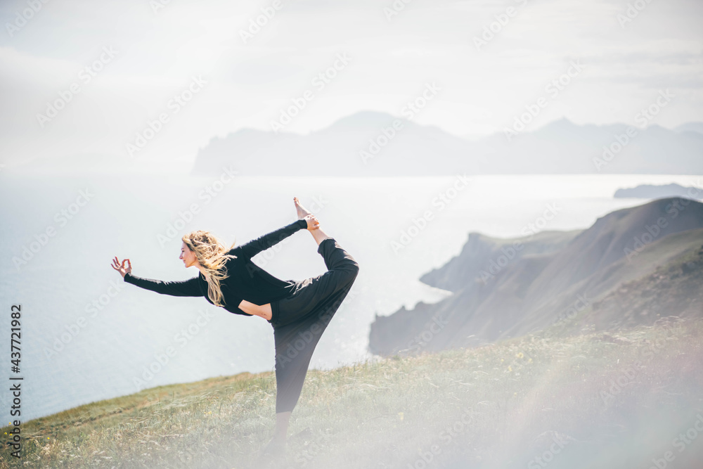 Woman practice yoga in an amazing landscape. Woman practice yoga in an amazing landscape.