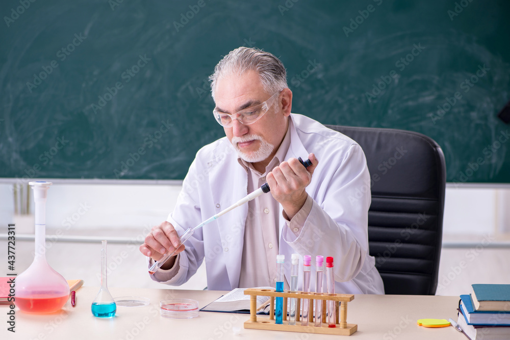 Experienced old scientist working in the lab Experienced old scientist working in the lab