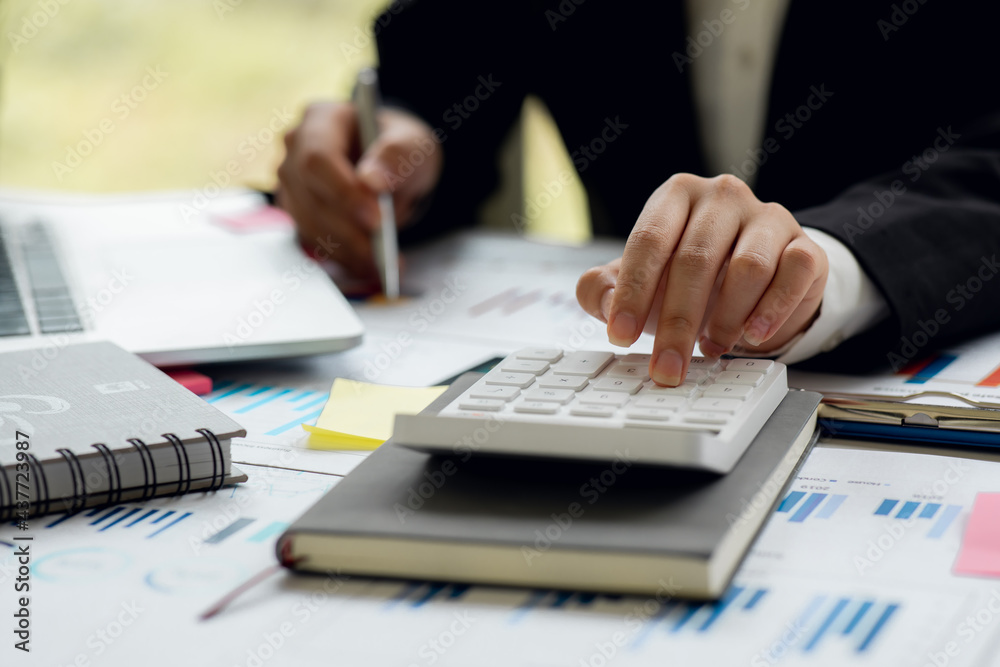 Businesswoman hands hold documents with financial statistic stock photo,discussion and analysis data the charts and graphs.Finance, Market research reports and income statistics and Accounting concept Businesswoman hands hold documents with financial statistic stock photo,discussion and analysis data the charts and graphs.Finance, Market research reports and income statistics and Accounting concept