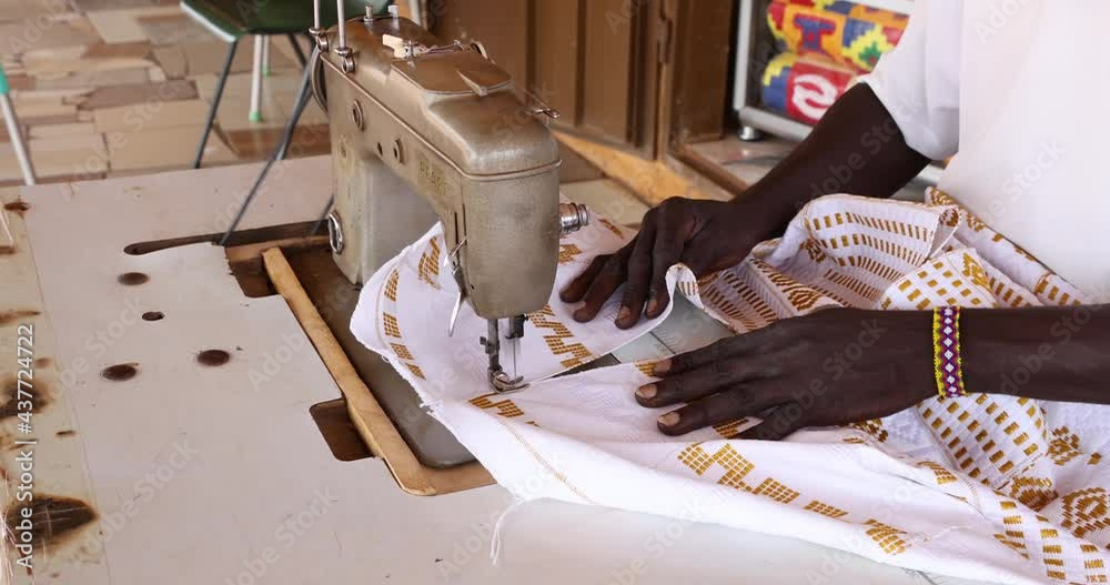 Kente Machine Sewing hand loom Kente strips cloth fabric Kumasi Ghana. Aa town in ...