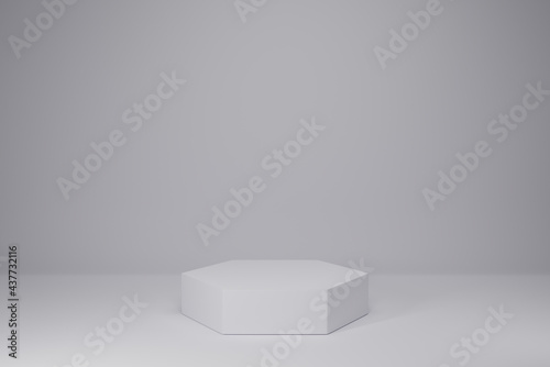 White hexagon pedestal empty on white background. 3D rendering podium for product demonstration.