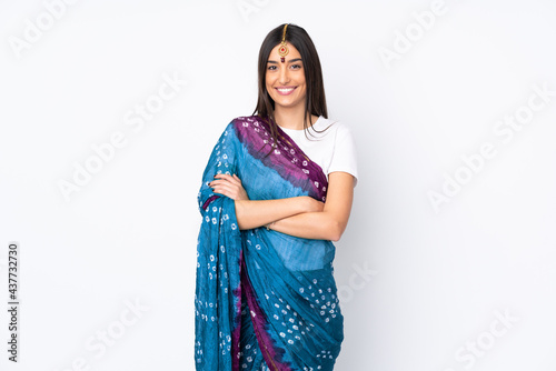Young Indian woman isolated on white background keeping the arms crossed in frontal position