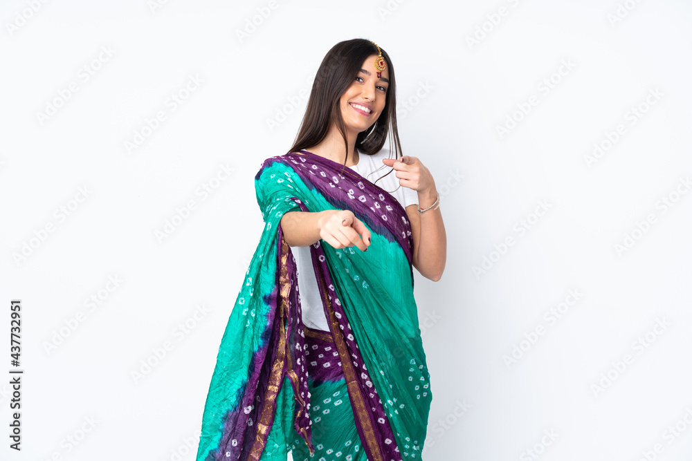 Young Indian woman isolated on white background points finger at you while smiling Young Indian woman isolated on white background points finger at you while smiling