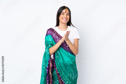 Young Indian woman isolated on white background applauding after presentation in a conference