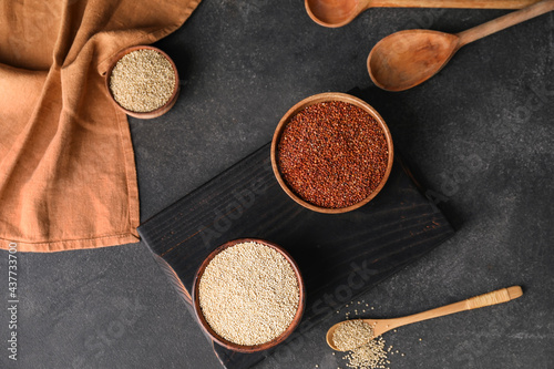 Different healthy quinoa on dark background
