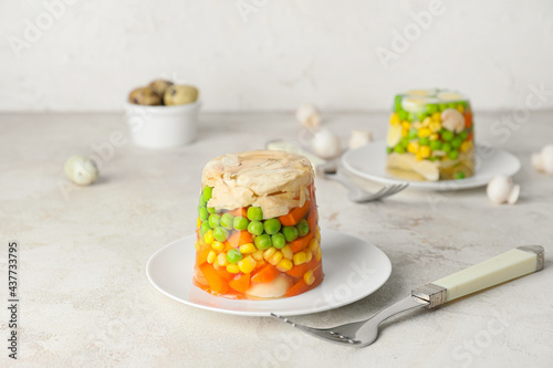 Plate with tasty aspic on table photo