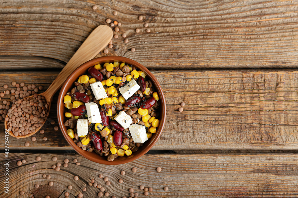Bowl of tasty cooked lentils, beans and cheese on table Bowl of tasty cooked lentils, beans and cheese on table