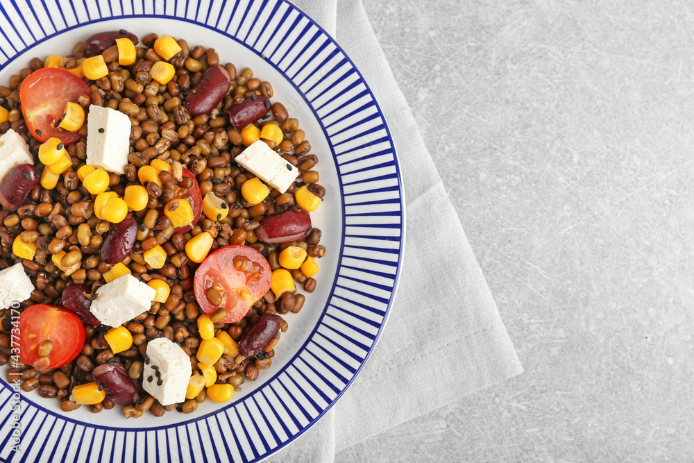 Plate with tasty cooked lentils, beans and cheese on table Plate with tasty cooked lentils, beans and cheese on table