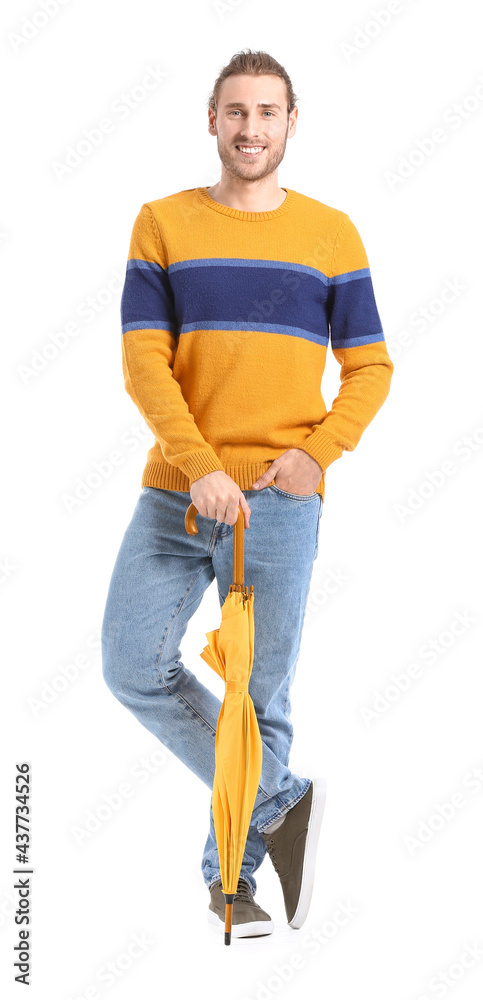 Handsome young man with umbrella on white background