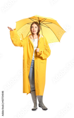 Stylish young woman in rain...