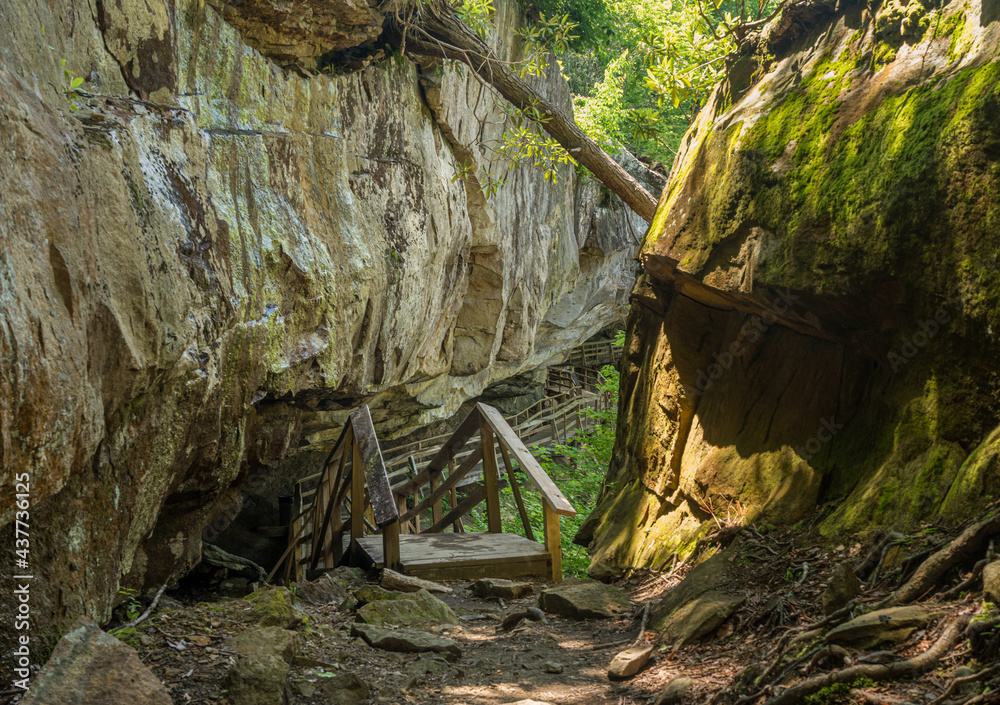 Wooden boardwalk and walkway under the cliffs in the Audra State Park near Buckhannon in West Virginia