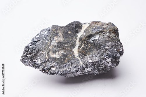 Silver ore, raw mineral stone isolated on white background, mining industry value