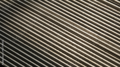 A metallic pipe striped background.