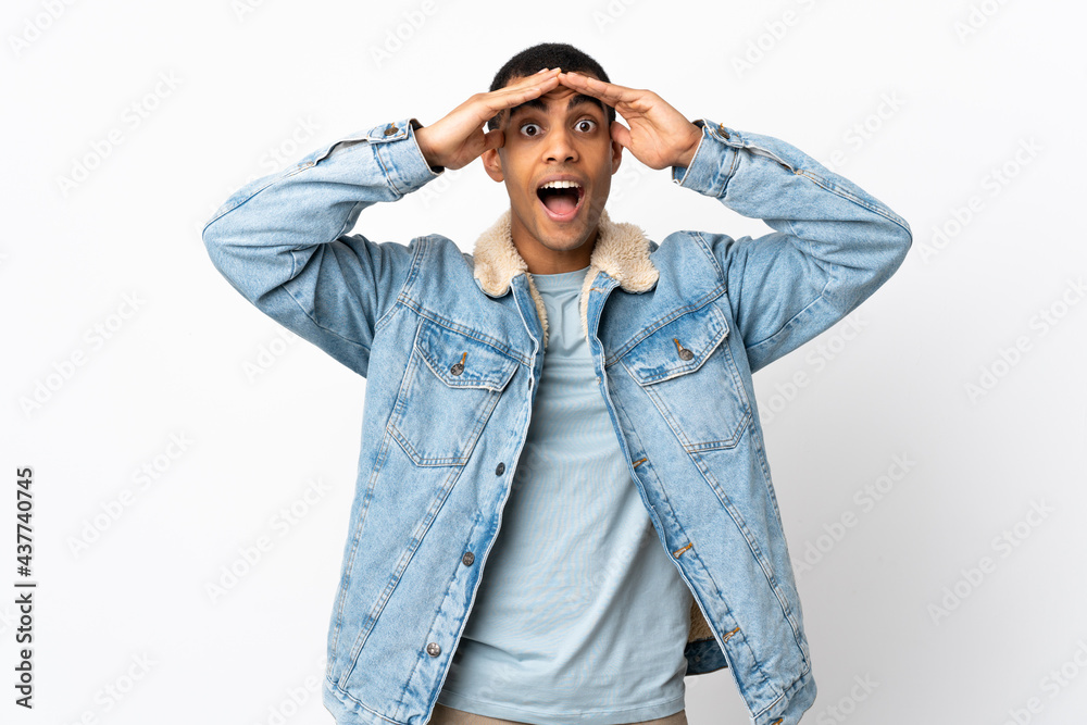 African American man over isolated white background with surprise expression African American man over isolated white background with surprise expression