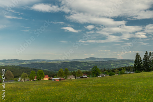 Meadows and forests near Javornik hill and village in Sumava national park