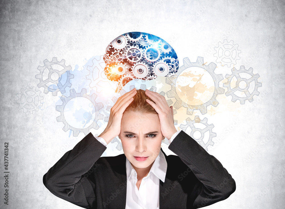 Businesswoman with hands on head, gears and colourful brain sketch on grey wall Businesswoman with hands on head, gears and colourful brain sketch on grey wall