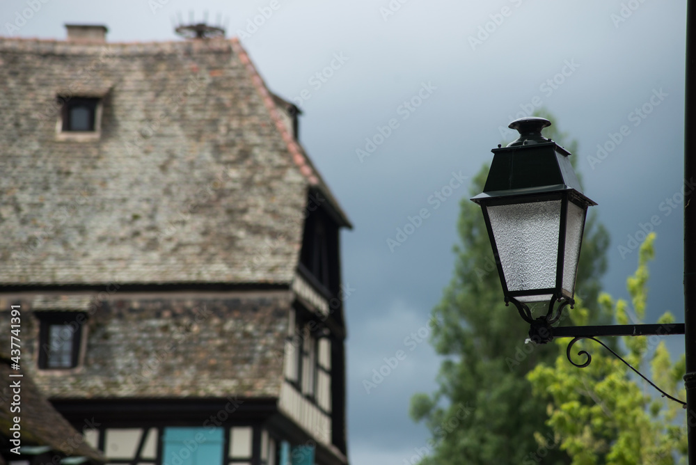 Closeup of vintage street lamp on medieval architecture background