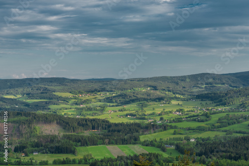 Meadows and forests near Javornik hill and village in Sumava national park
