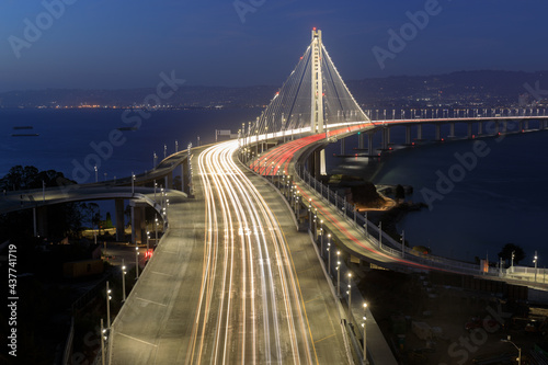 Directly above the San Francisco-Oakland Bay Bridge Eastern Span during the blue hour. Treasure Island, San Francisco, California, USA.